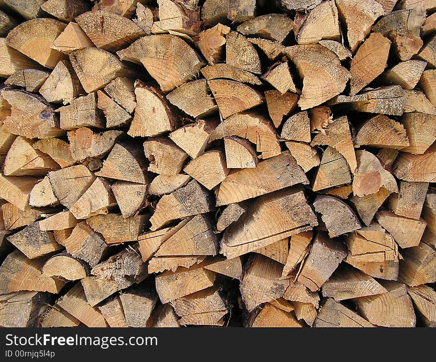 Lots of tree trunks in a wood warehouse. Lots of tree trunks in a wood warehouse