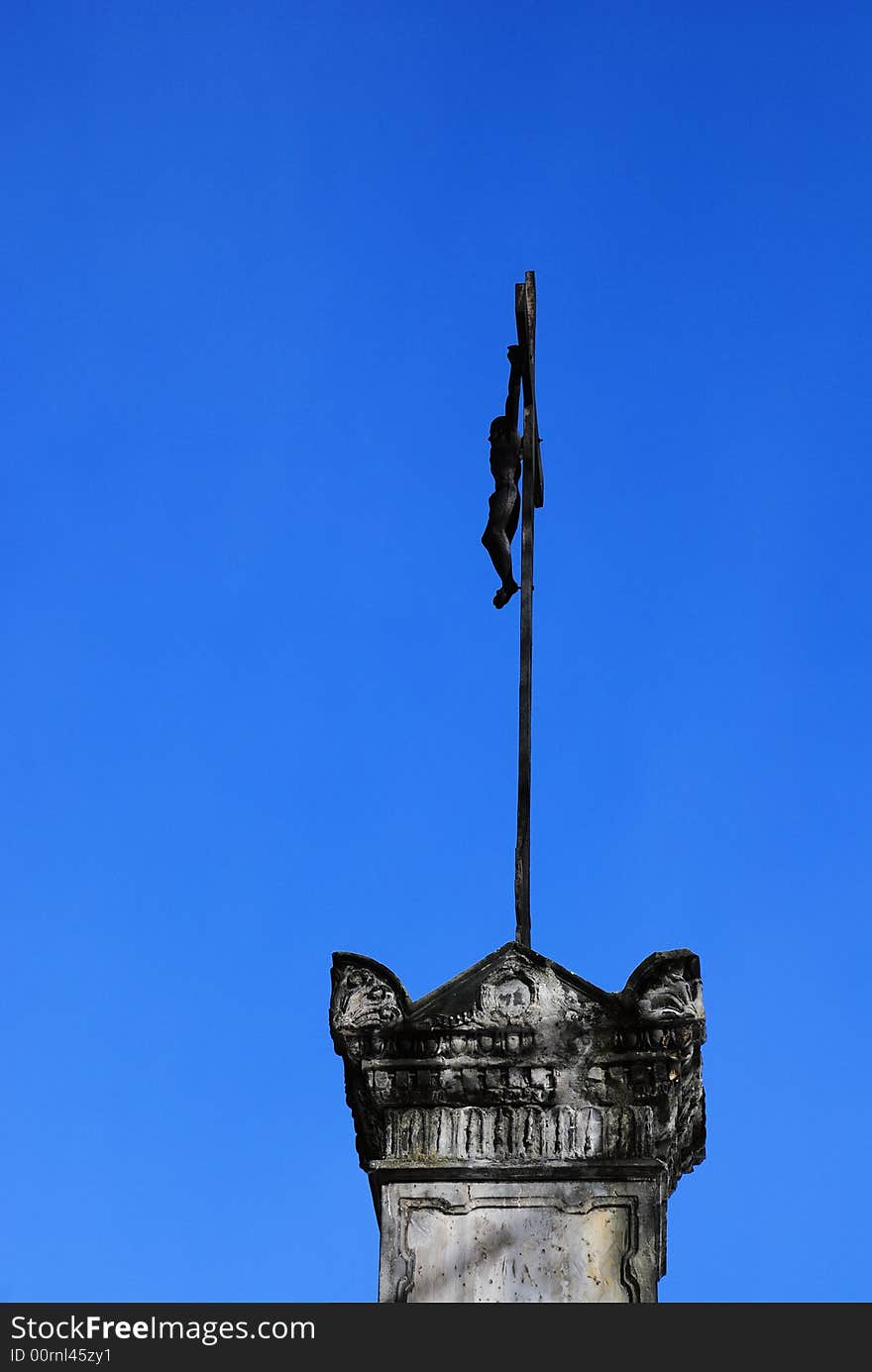 Old cross at the blue sky