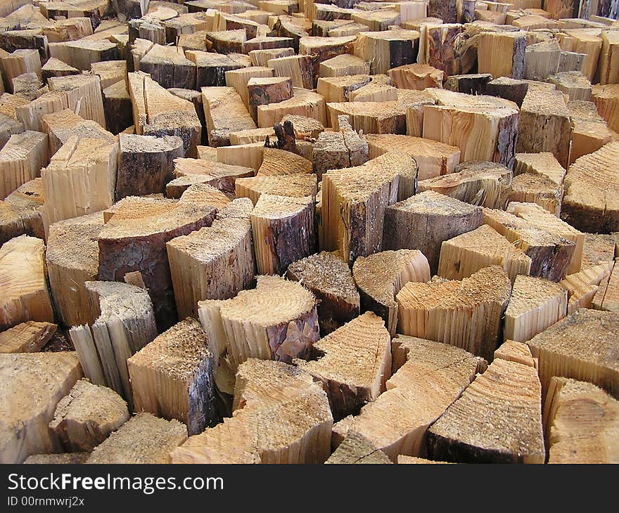 Lots of tree trunks in a wood warehouse. Lots of tree trunks in a wood warehouse