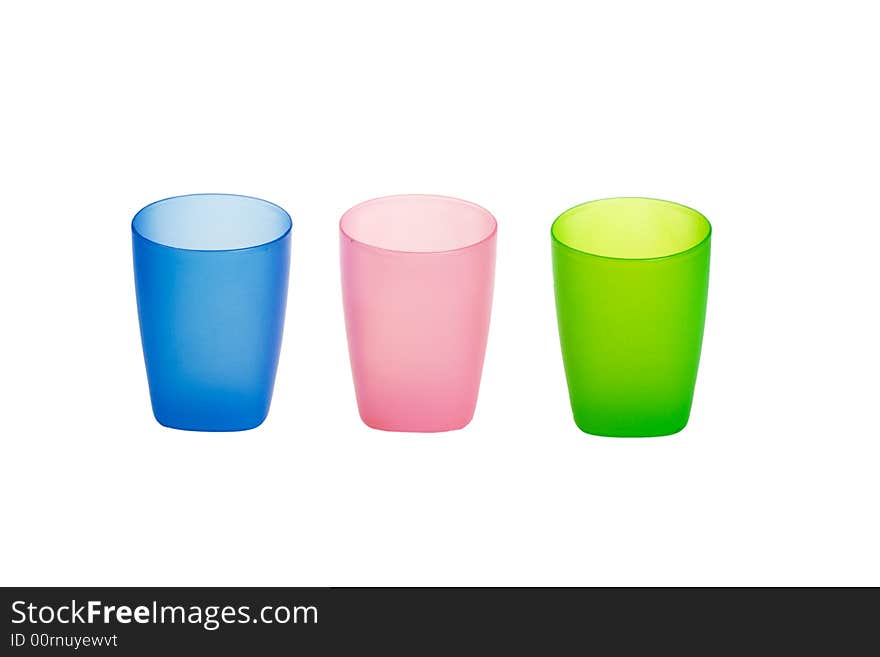 Three color plastic glasses isolated on a white background