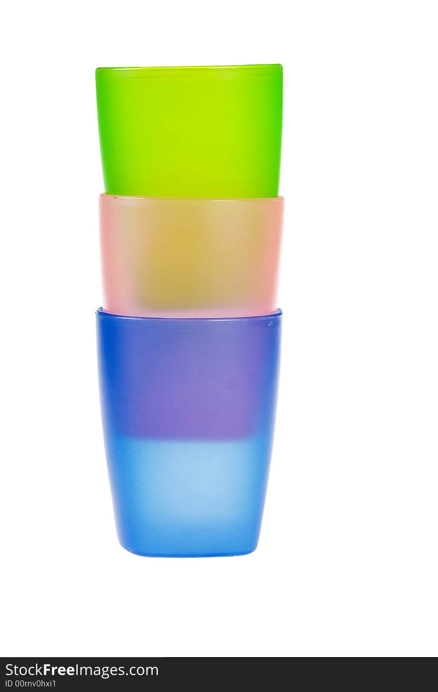 Three color plastic glasses isolated on a white background