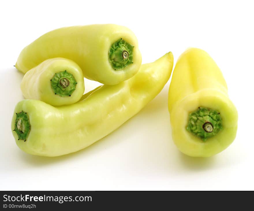 Green-yellow peppers isolated on white background