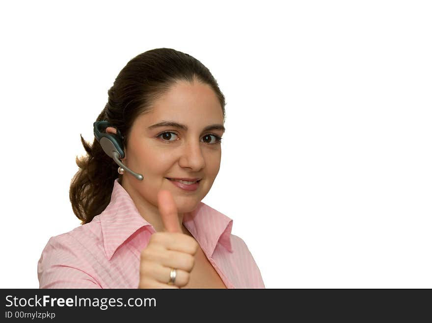 A girl, wearing bluetooth earpiece, holding her thumb up. A girl, wearing bluetooth earpiece, holding her thumb up