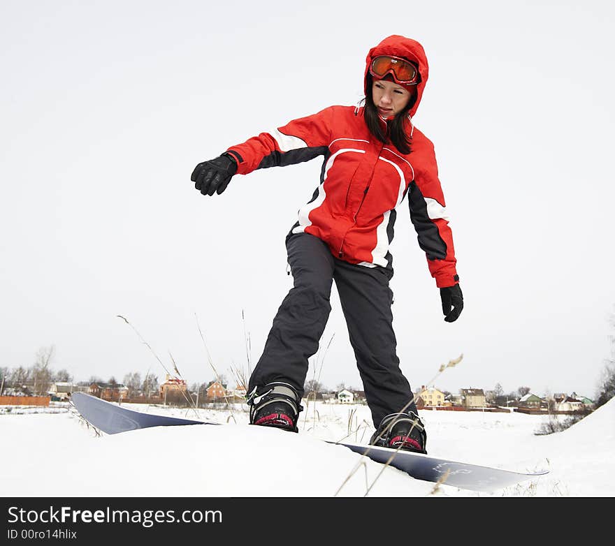 Young adult female snowboarder