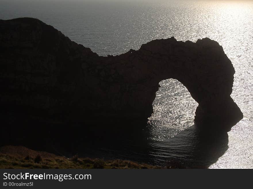 South of Britain, Dorset, uk, natural arch eroded in limestone. South of Britain, Dorset, uk, natural arch eroded in limestone