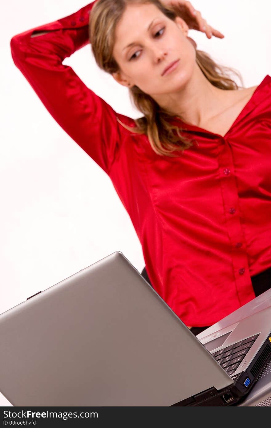 Nice caucasian girl dressed red with laptop isolated on white. Nice caucasian girl dressed red with laptop isolated on white