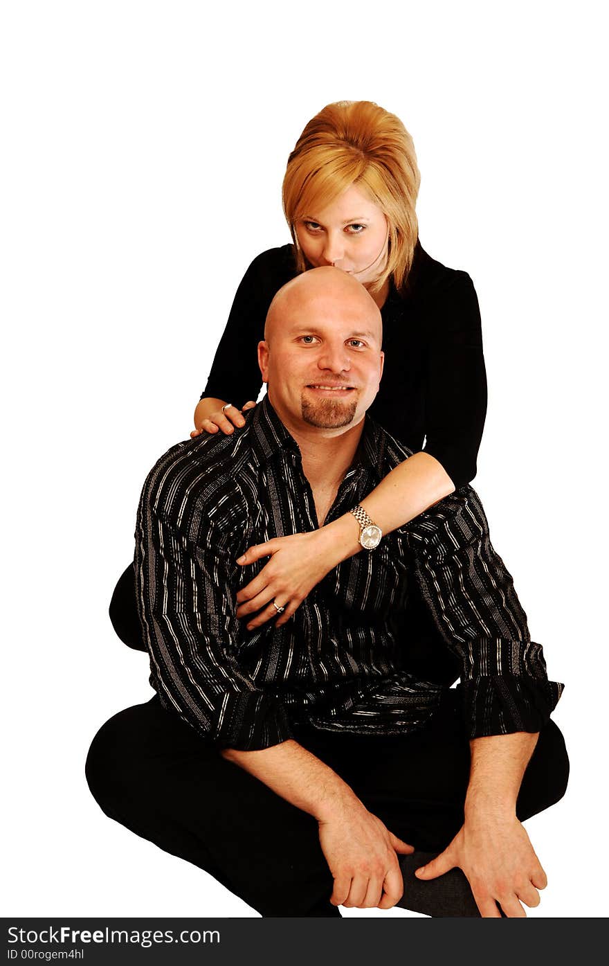 Young Couple Sitting On The Floor.