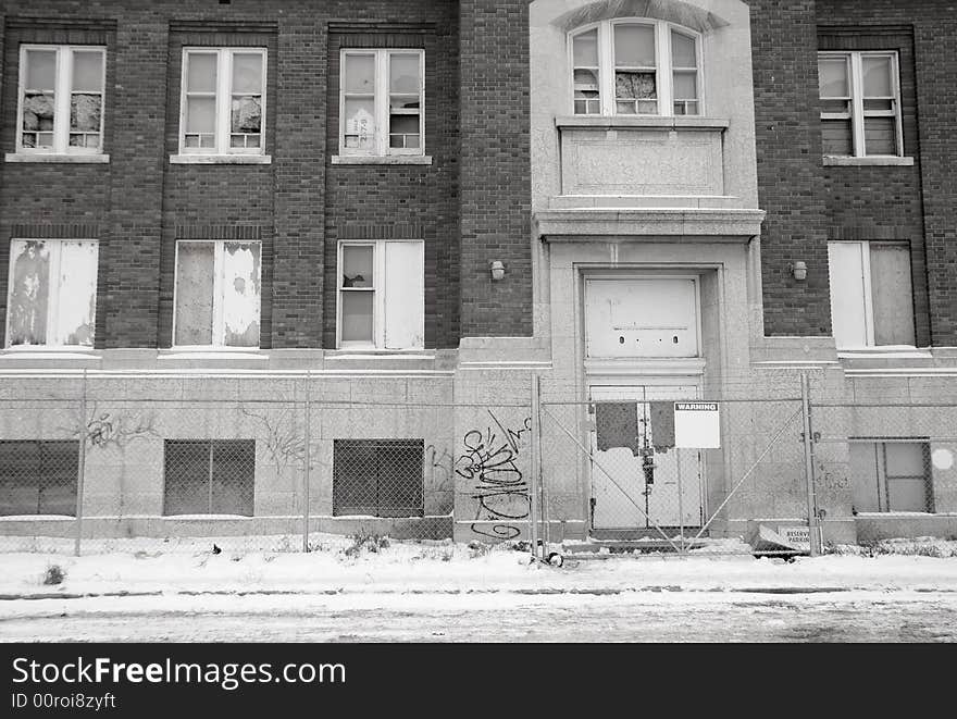 Black and white detail of an old abandoned school