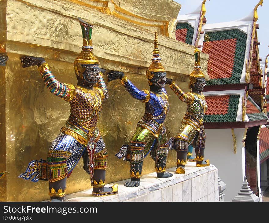 Ornate characters as part of Buddhist temple architecture in Bangkok, Thailand. Ornate characters as part of Buddhist temple architecture in Bangkok, Thailand