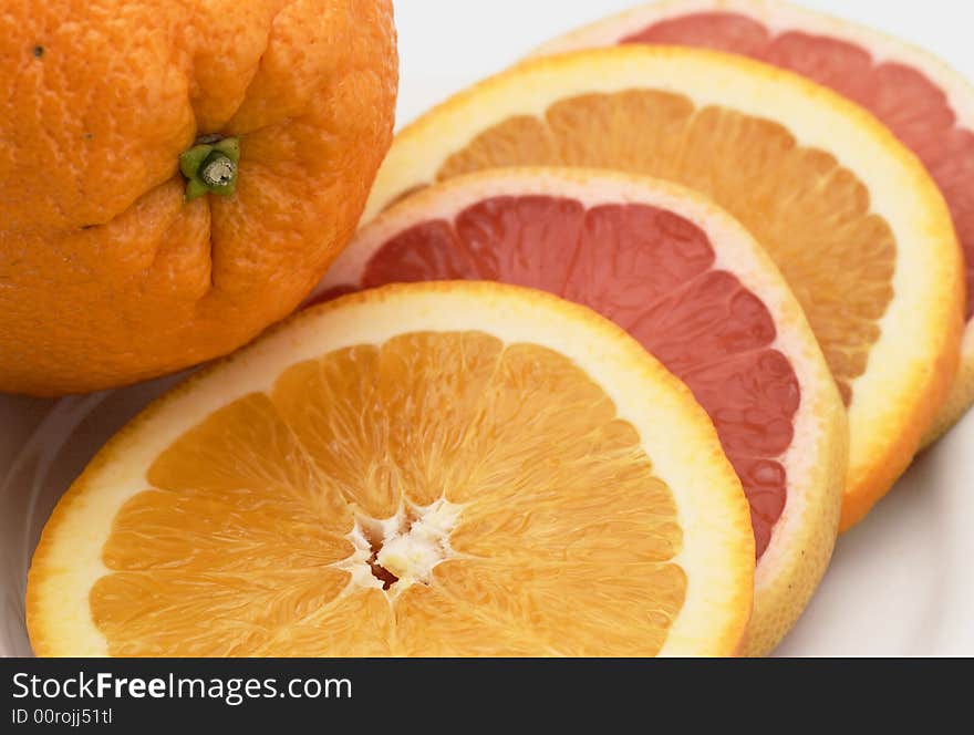 Sliced orange and pink grapefruit