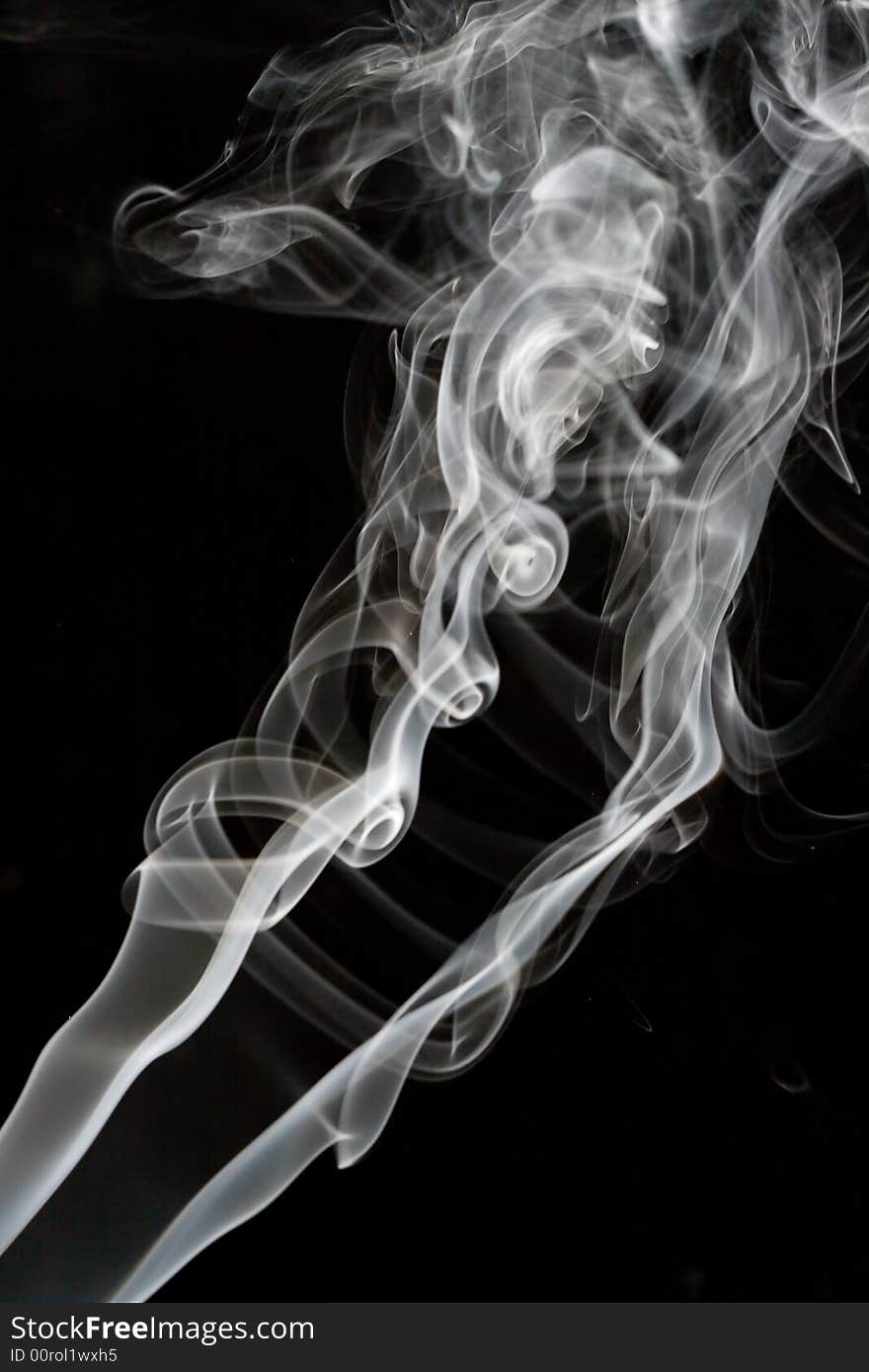 White smoke rising up with black background