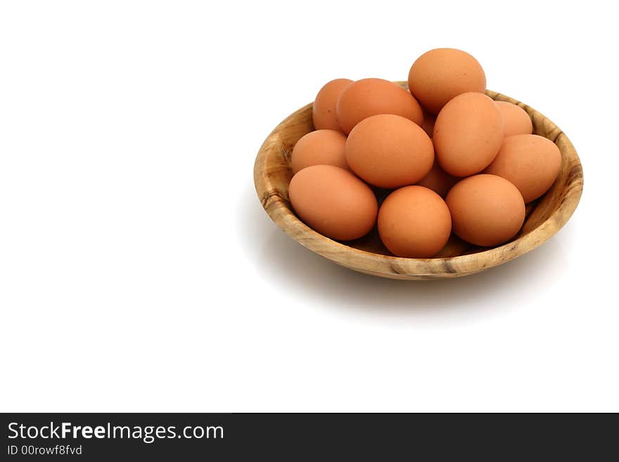 Brown eggs on white background