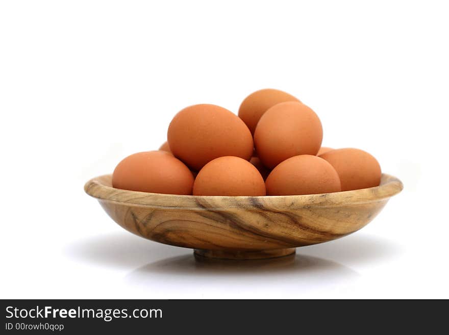 Brown eggs on white background