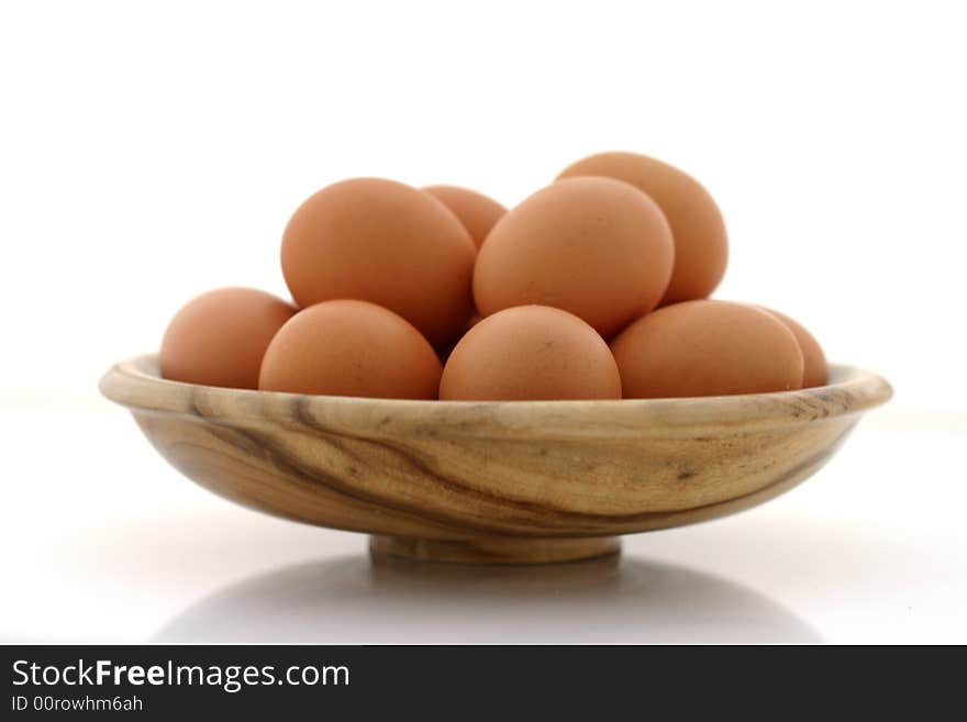 Brown eggs on white background