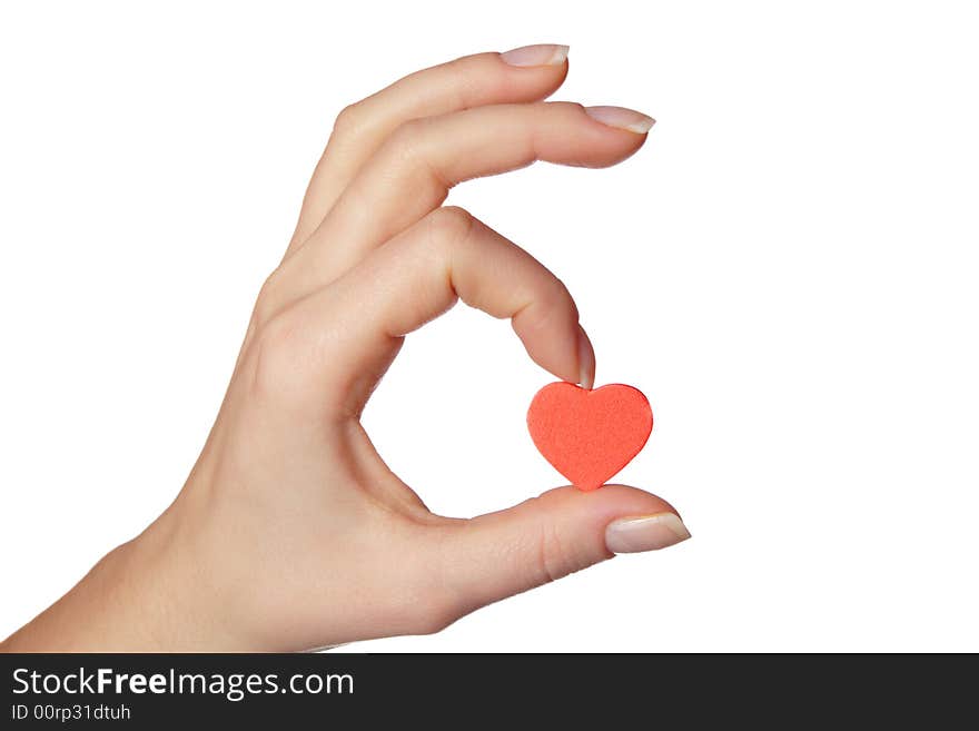 Female hand holding little red heart.Isolated on white background.