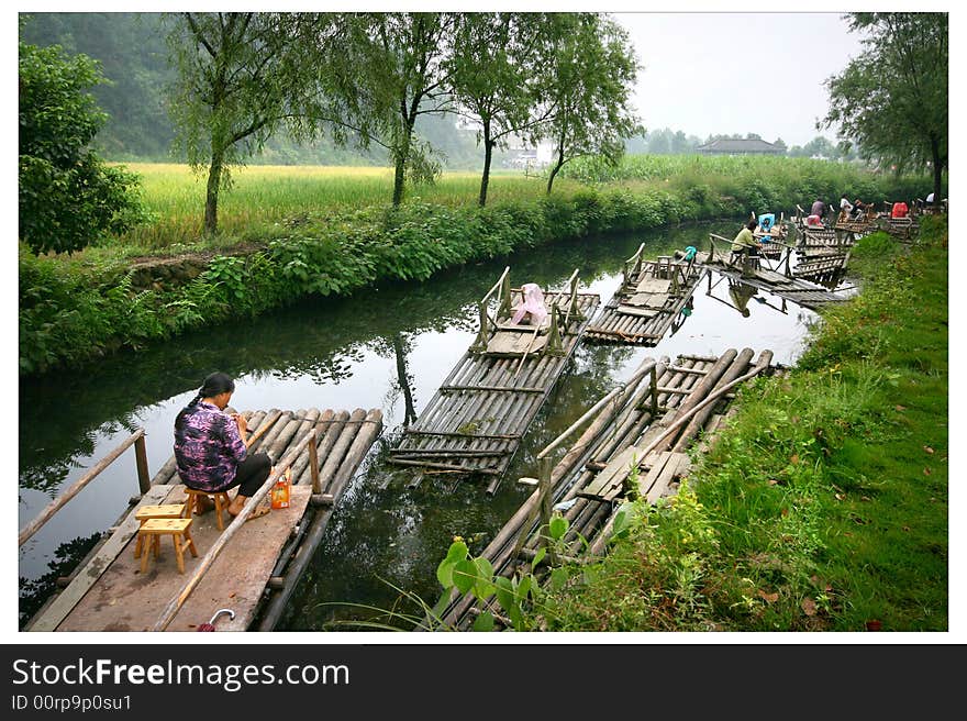 This is a beautiful town; it is located in jiangxi province in the south of China. Not to the tourist season, the town people will strike the bamboo raft, with guests in the small town, appreciate beauty through. Women are in the graph braid sweater; treat the arrival of the guests. This is a beautiful town; it is located in jiangxi province in the south of China. Not to the tourist season, the town people will strike the bamboo raft, with guests in the small town, appreciate beauty through. Women are in the graph braid sweater; treat the arrival of the guests..