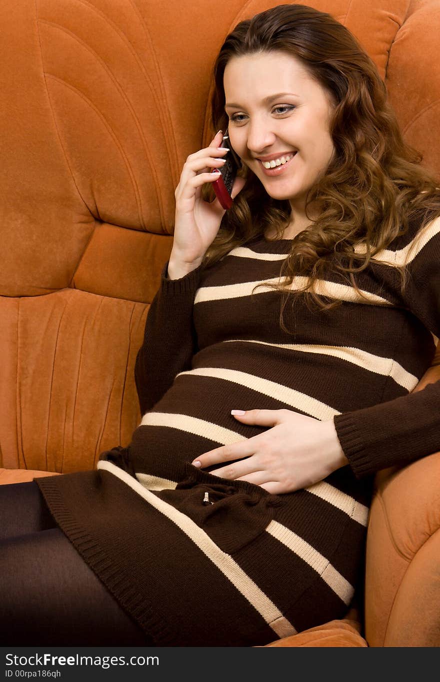 Beauty pregnant women talking at mobile phone