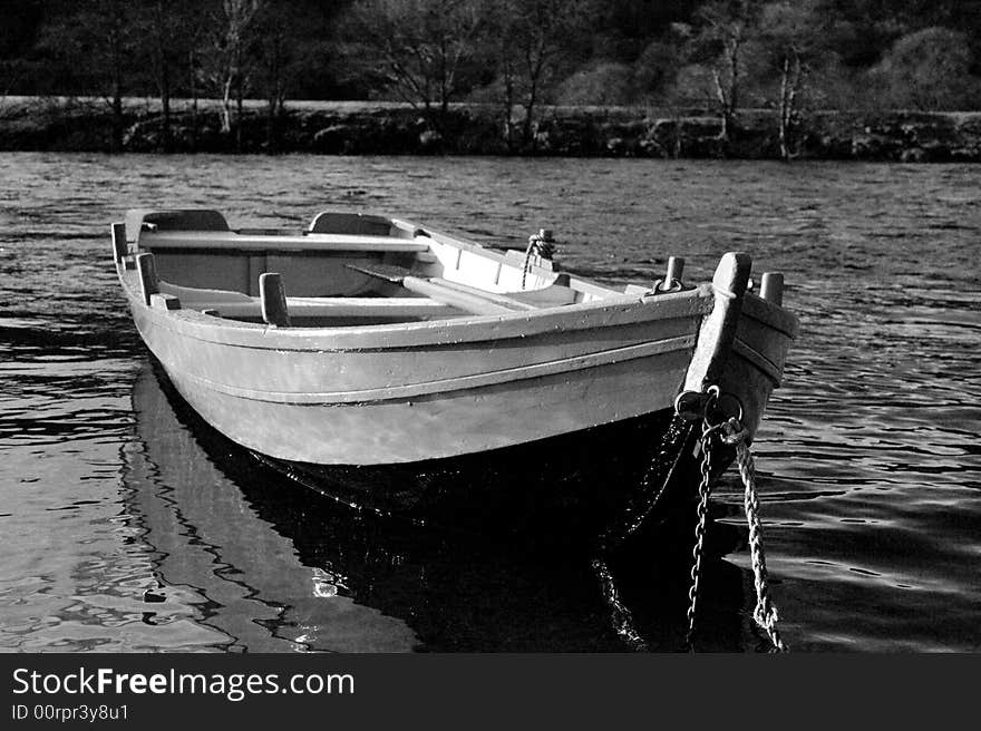 River Boat photographed on the River Tummel. Black and white and shot on a high ISO to add grain