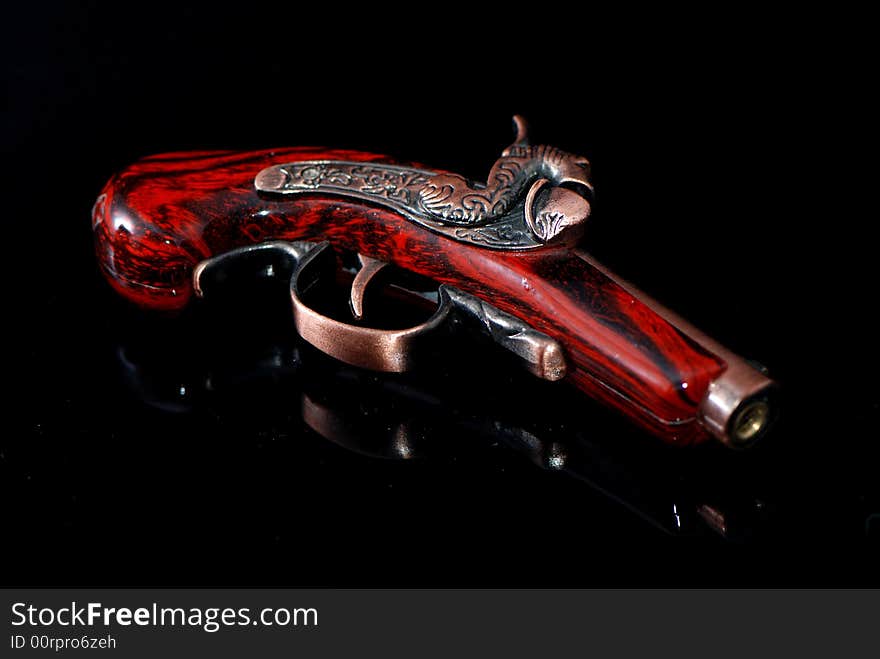 An old hand gun，with red。