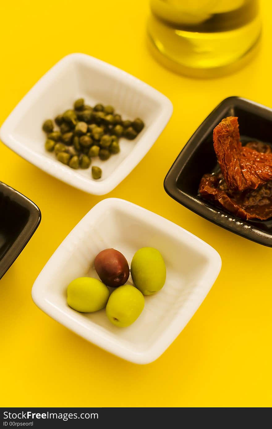 Mediterranean food main ingrediments on the yellow table