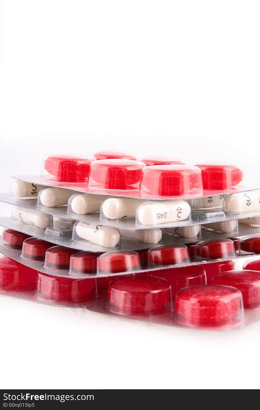 A red pile of medicines. A red pile of medicines