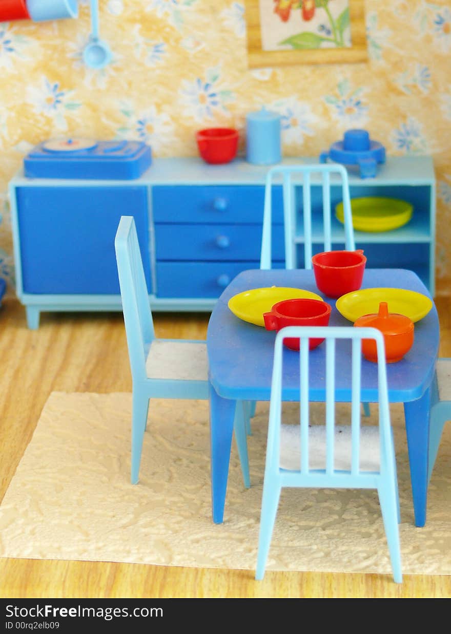 Nip bottle of table with three chairs in eating room. Nip bottle of table with three chairs in eating room