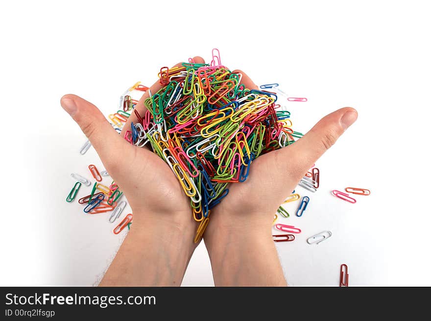 Hands full of paper clips isolated on white 2. Hands full of paper clips isolated on white 2