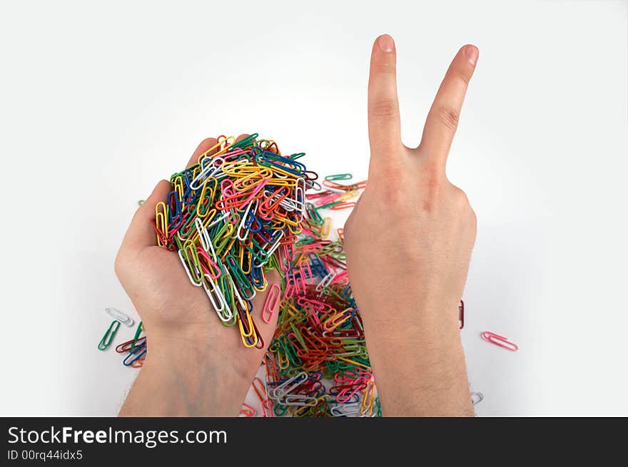 Hands holds paper clips and gives gesture isolated on white 5. Hands holds paper clips and gives gesture isolated on white 5