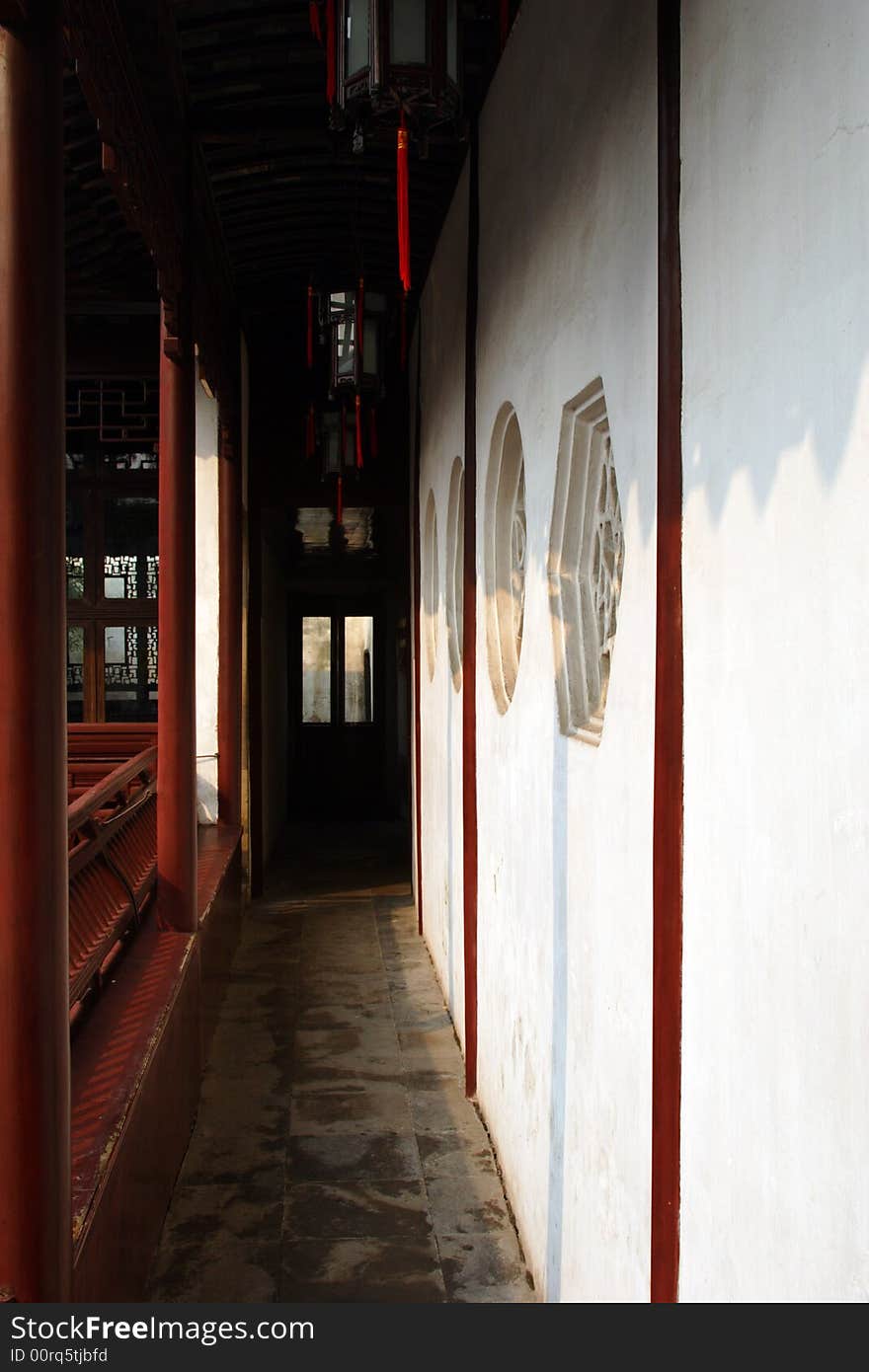 An ancient corridor is supported with pillars.This picture is taken in Net lion wood in Suzhou ,China.