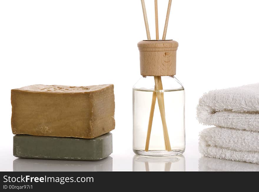 Aroma therapy objects. bottle of esential oil, towels, soap