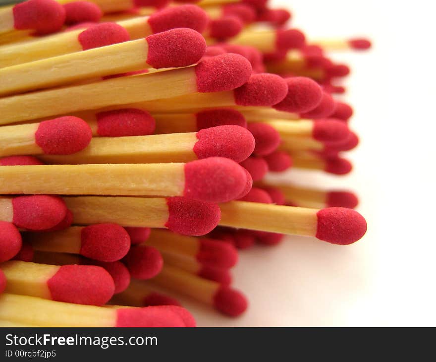 A close up of pile of red-tipped cooks matches