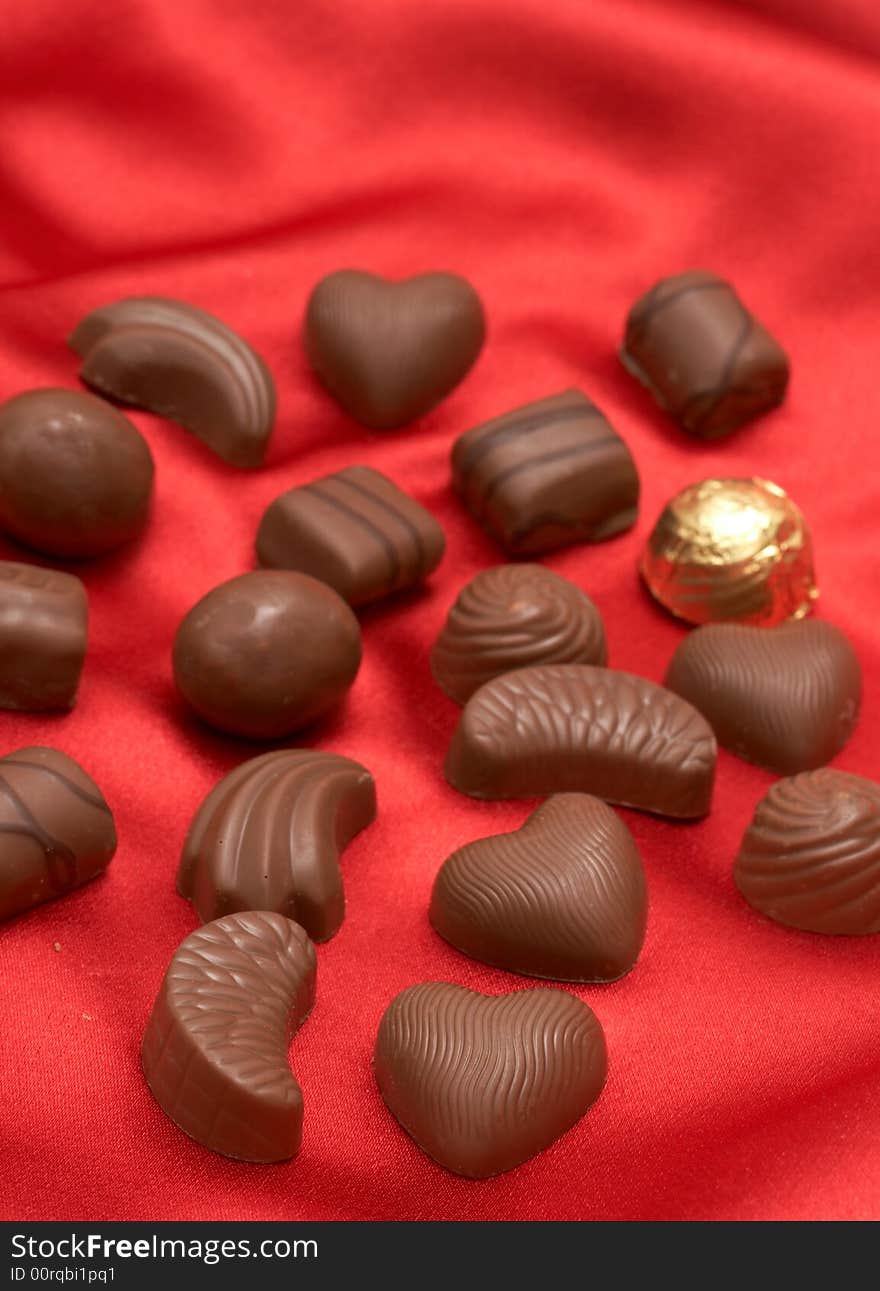 Valentines chocolates on red silk