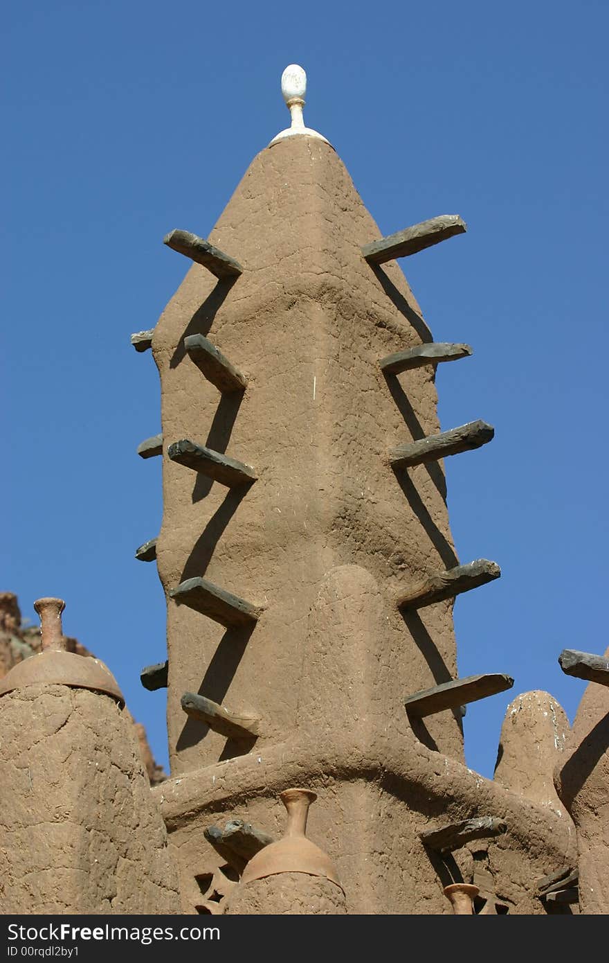 Minaret of a traditional mosk made of mud in Mali, West Africa. Minaret of a traditional mosk made of mud in Mali, West Africa