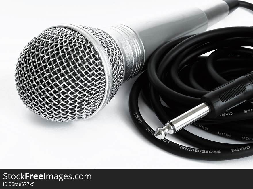 Microphone and cable on on a white background.