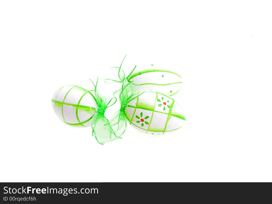 Green painted easter eggs on white background