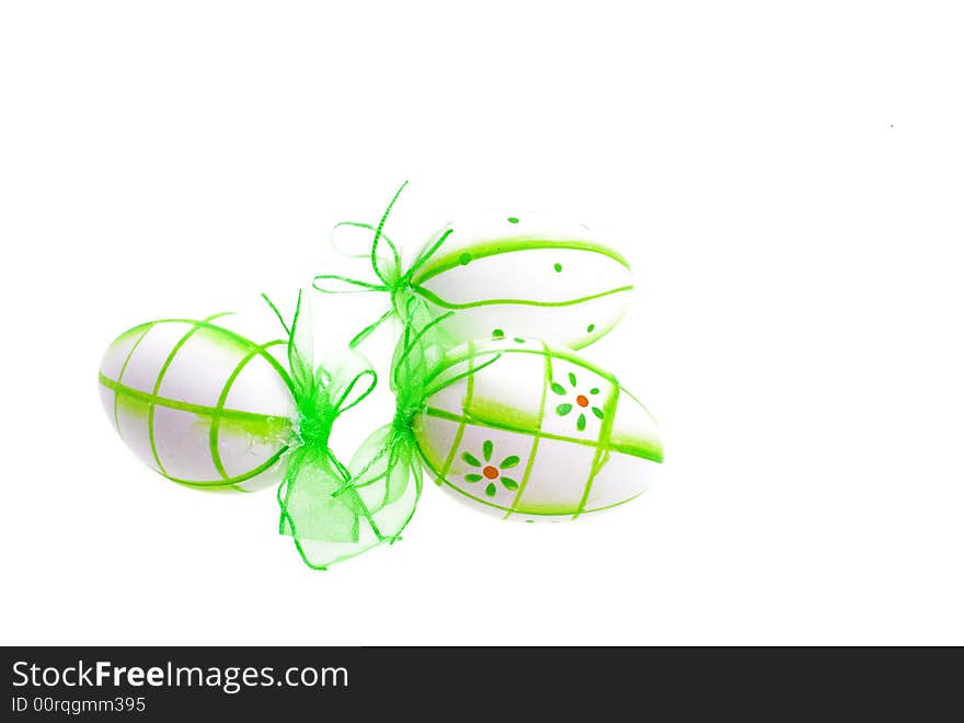 Green painted easter eggs on white background