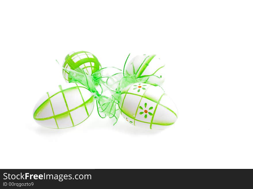 Green painted easter eggs on white background