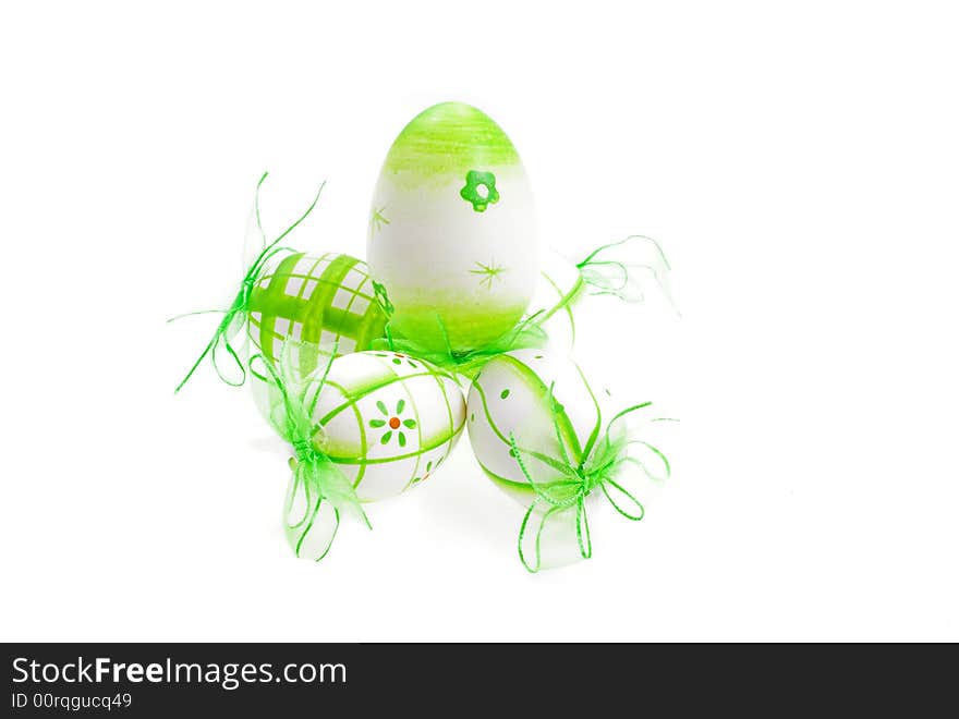 Green painted easter eggs on white background