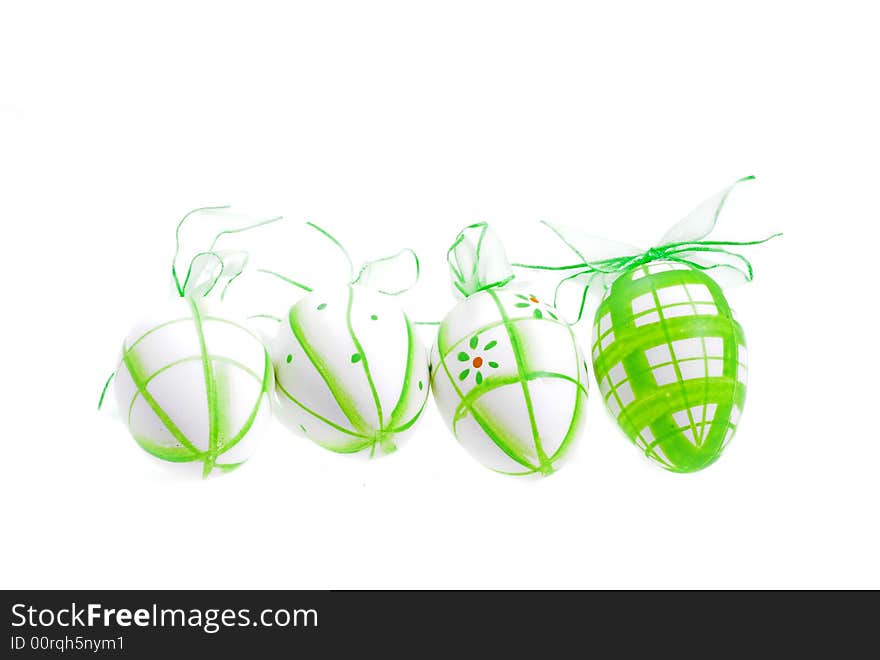 Green painted easter eggs on white background