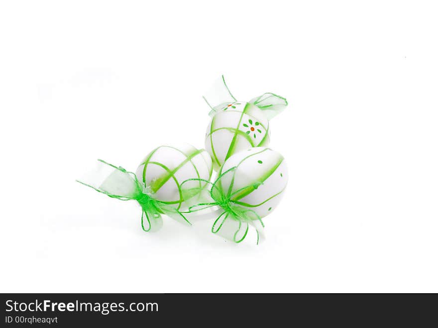 Green painted easter eggs on white background