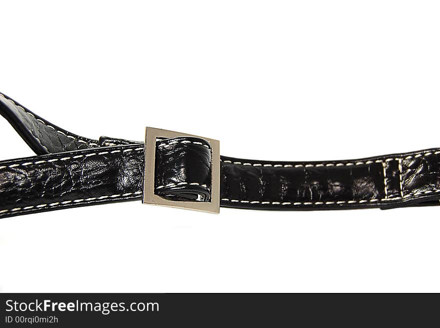 Buckle of a black leather bag isolated on white. Buckle of a black leather bag isolated on white