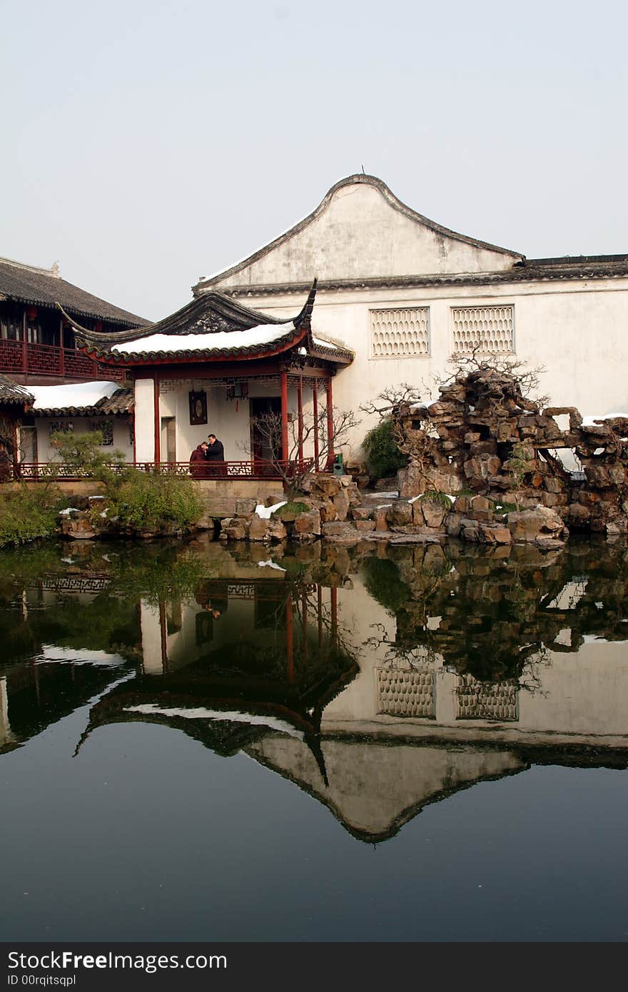 A pavilion with it's beautiful surroundings and their reflection in the water.This picture is taken in Net lion park in Suzhou ,China.