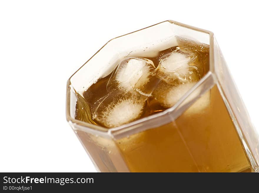 Alcohol and ice in glass