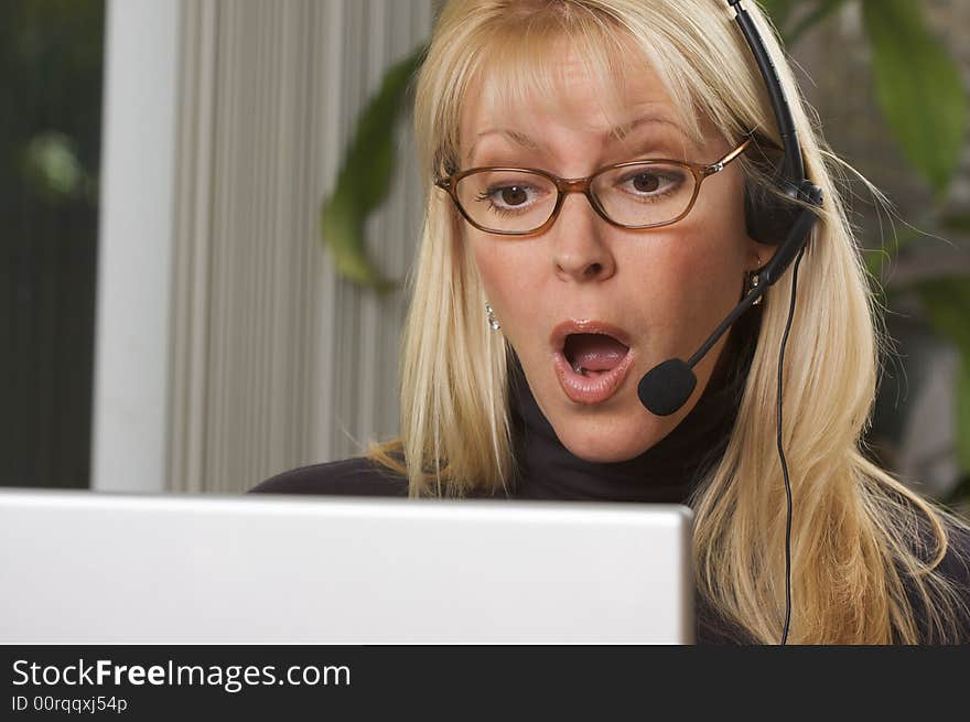 Attractive Businesswoman with Phone Headset