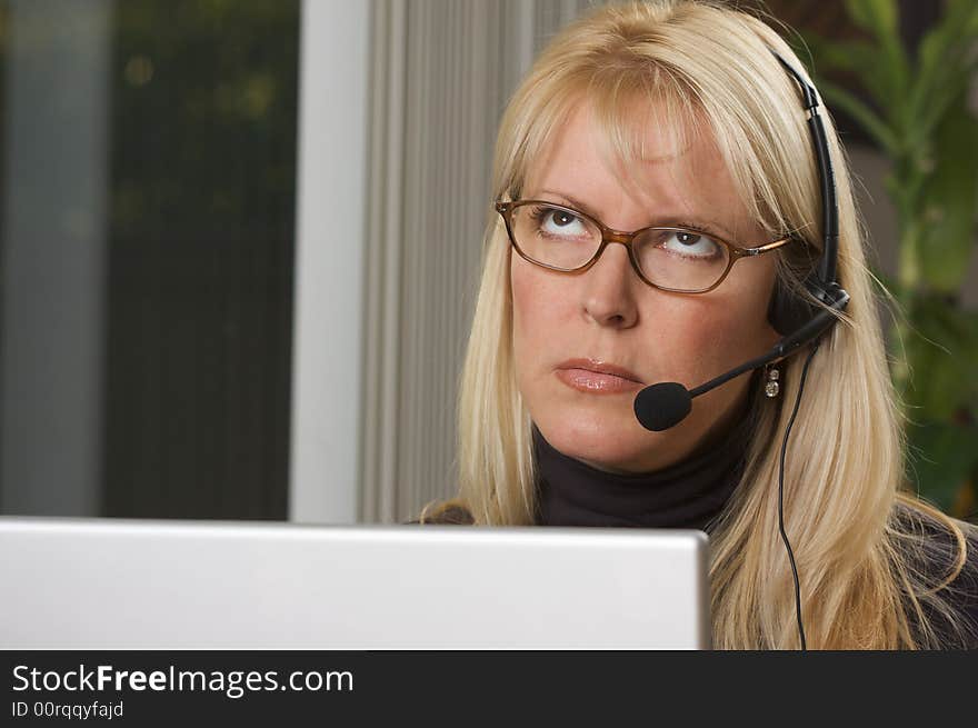 Attractive Businesswoman with Phone Headset