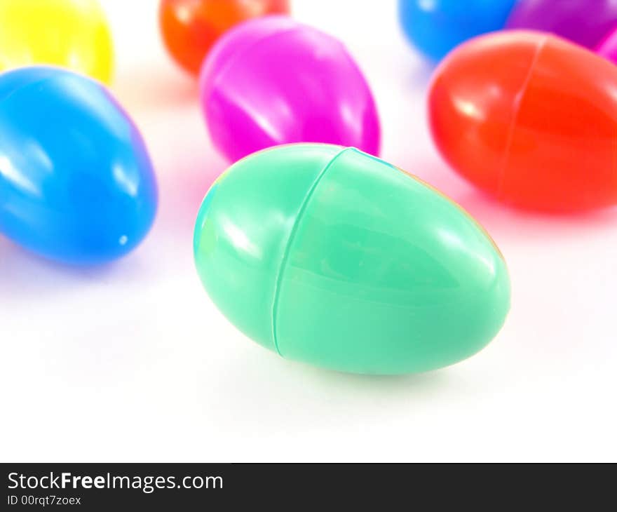 Multi-colored plastic easter in many colors on white background. Multi-colored plastic easter in many colors on white background