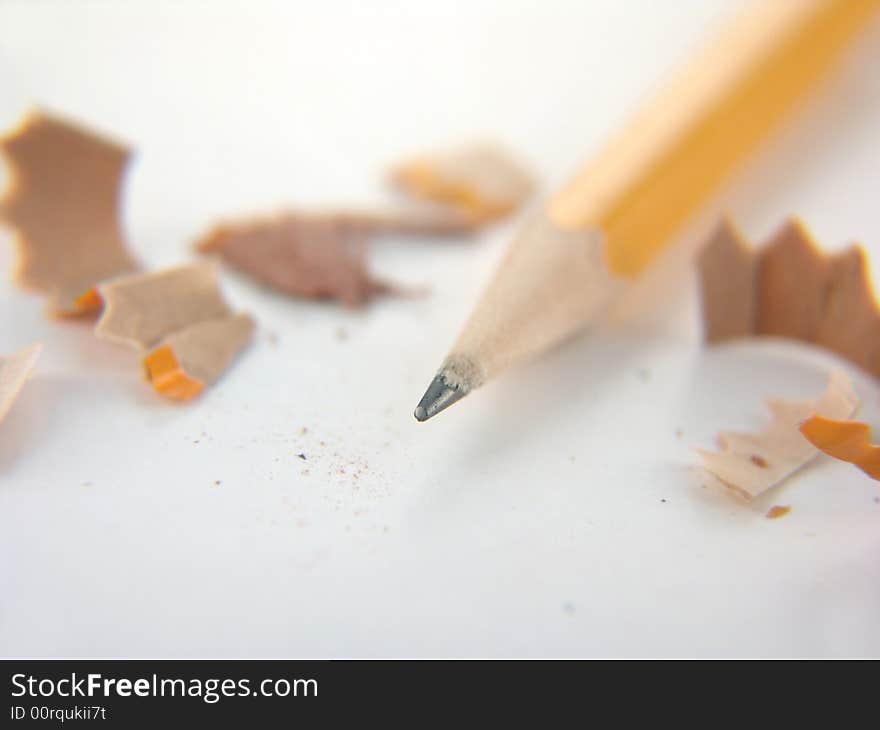 Yellow number two pencil with shavings isolated on white background