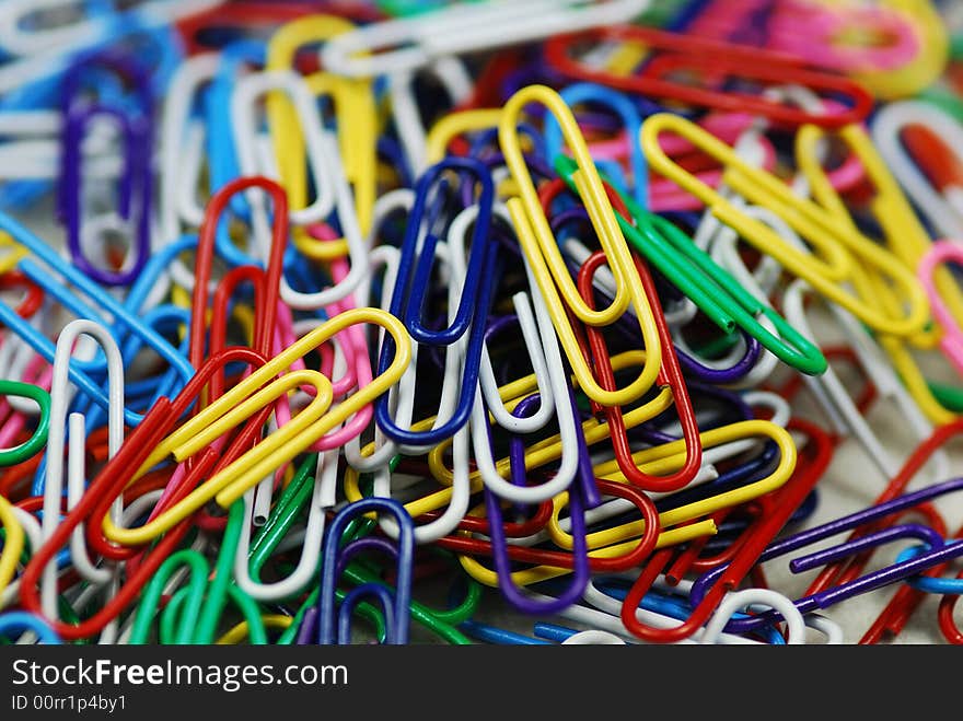 A bunch of colorful paper clips close up