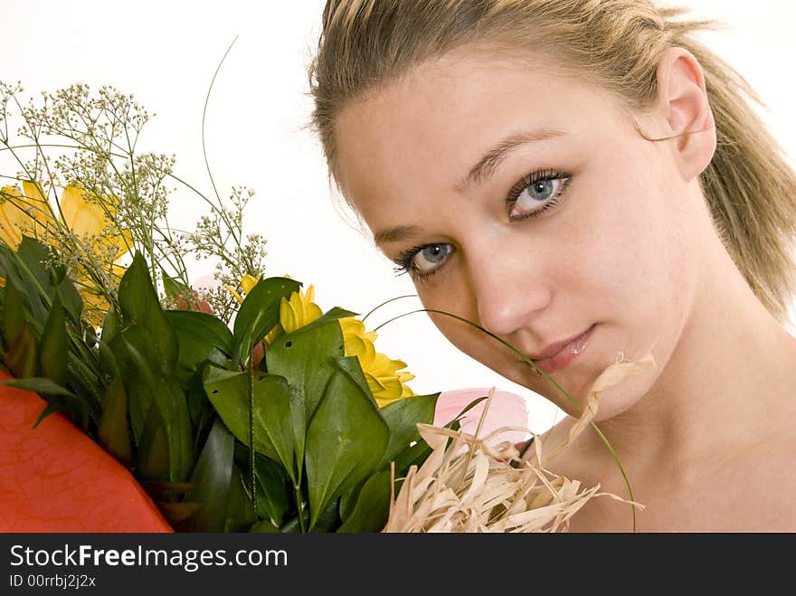 Young girl holding her flowers. Young girl holding her flowers