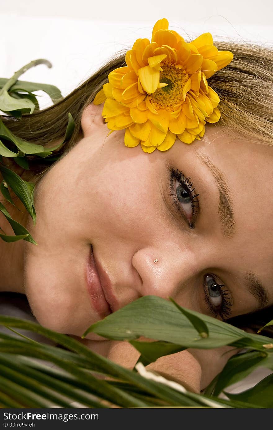 Girl relaxing covered with leaves. Girl relaxing covered with leaves